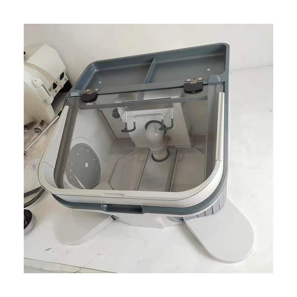 JT-69 dust collection cover, open three-quarter view showing the interior suction inlet, side compartments and elbow-rest layout