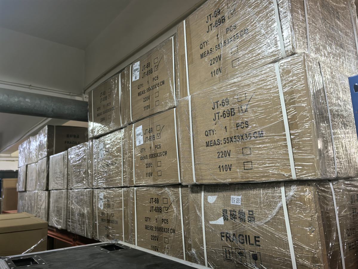 Shrink-wrapped export cartons stamped with model JT-69, measurements and a 220V/110V tick box